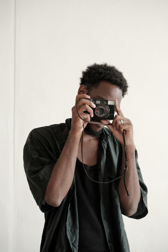 Man Taking a Photo with Camera