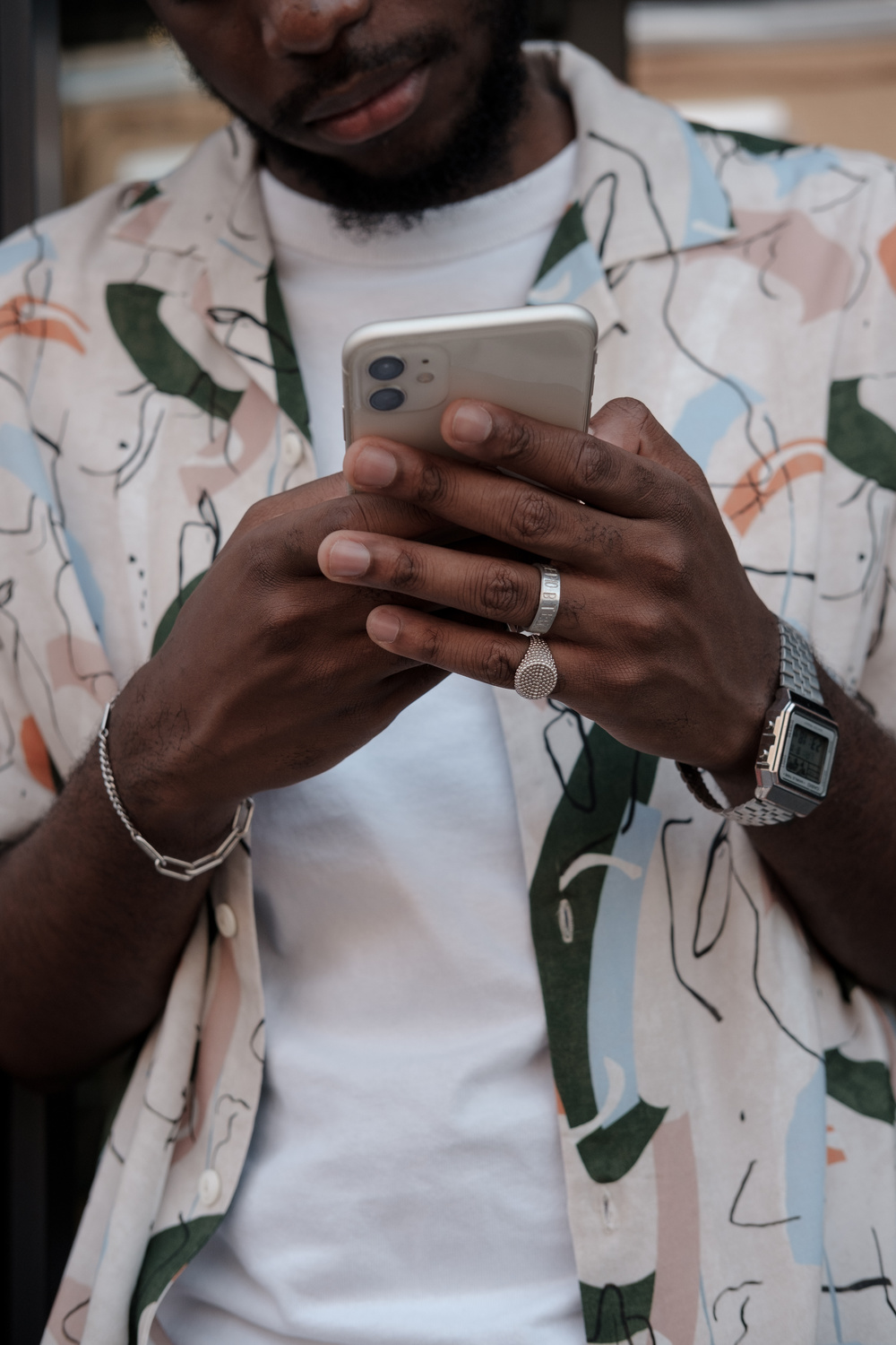 Man Using Smartphone While Standing on the Street